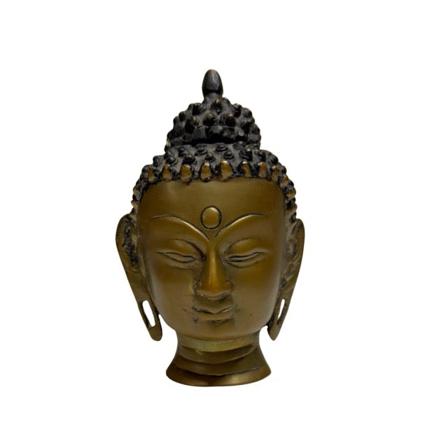 Vuurverguld boeddhahoofd uit Nepal als authentiek verzamelobject binnen boeddhistische kunst